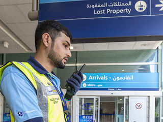 Dubai airport trolley staff with tetra radio Dubai airport trolley staff with tetra radio