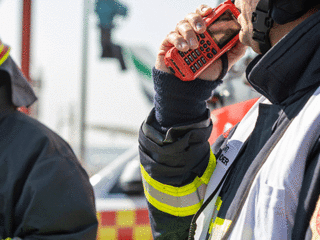 Fireman using thr9ex TETRA radio at Dubai airport Fireman using thr9ex TETRA radio at Dubai airport