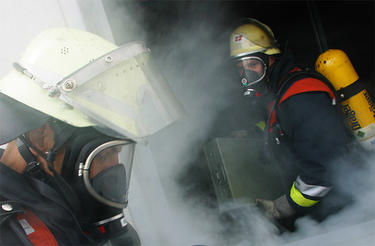 Two smokediving firefighters Two smokediving firefighters