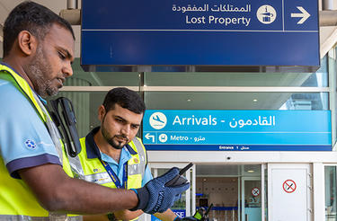 Dubai airport trolley staff with Dabat Dubai airport trolley staff with Dabat