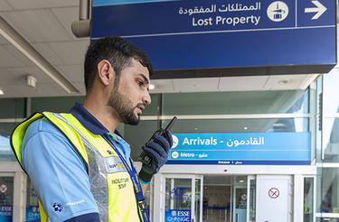 Dubai airport trolley staff with TETRA radio Dubai airport trolley staff with TETRA radio