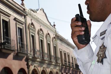 Police officer using a radio phone