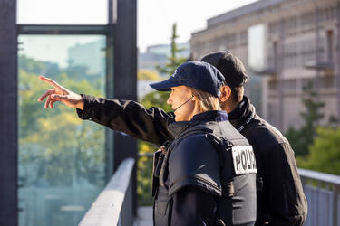 Police discussing with each other Police discussing with each other
