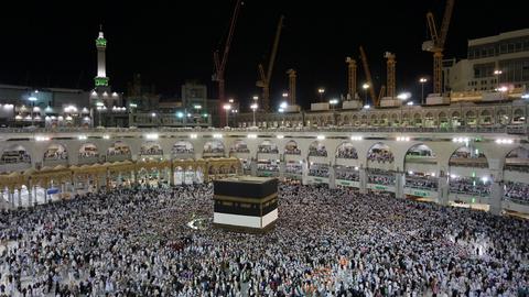 hajj pilgrimage in mecca people surrounding the kaaba in the night