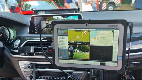 Broadway project mission critical app on a device in a car - fire departement in the back