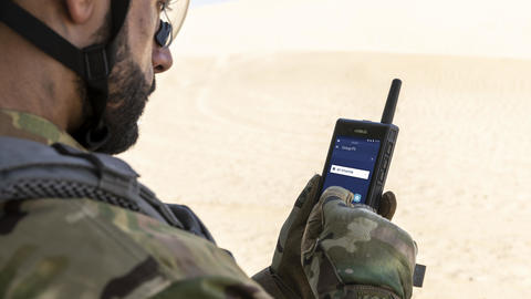 tactilon dabat - defence force - man using an airbus device in the desert