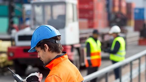 professional worker using TETRA radio in a port
