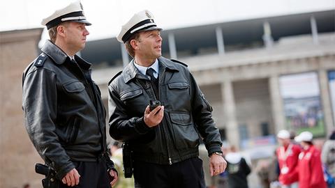 Two police officers at a sports event