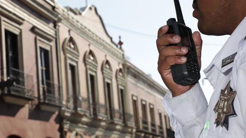 Police officer using a radio phone