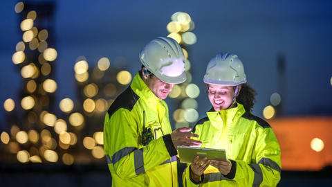 Industry professionals with a device