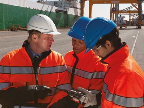 Industry workers using and device