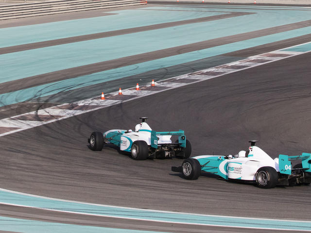 f1 race cars driving
