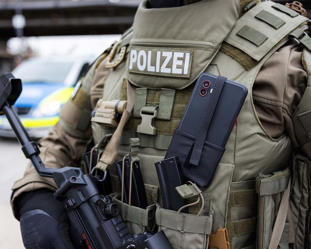 Swat officer has a Samsung galaxy xcover pro 6 mounted on his west Swat officer has a Samsung galaxy xcover pro 6 mounted on his west