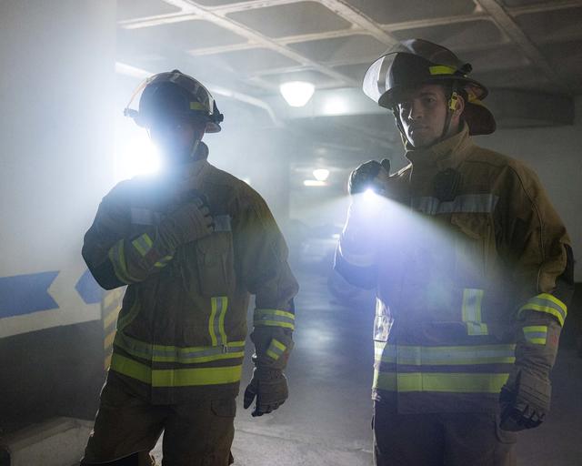 Firemen entering a building Firemen entering a building