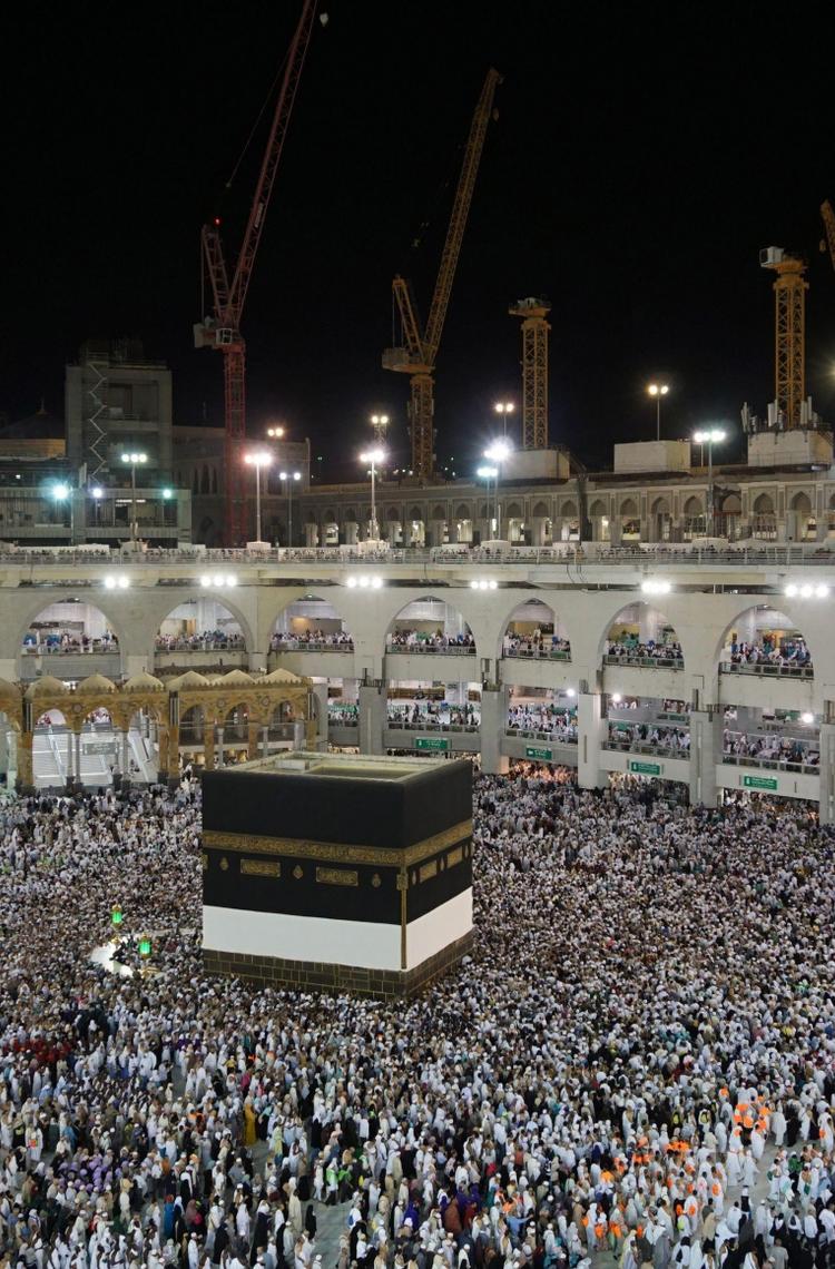 hajj pilgrimage in mecca people surrounding the kaaba in the night hajj pilgrimage in mecca people surrounding the kaaba in the night