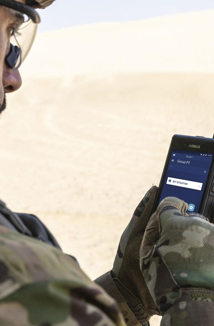 tactilon dabat - defence force - man using an airbus device in the desert tactilon dabat - defence force - man using an airbus device in the desert