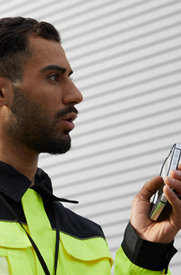 industry enterprise professional using a smartphone industry enterprise professional using a smartphone