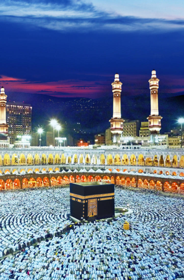Hajj pilgrimage in mecca - people praying surrounding the kaaba Hajj pilgrimage in mecca - people praying surrounding the kaaba