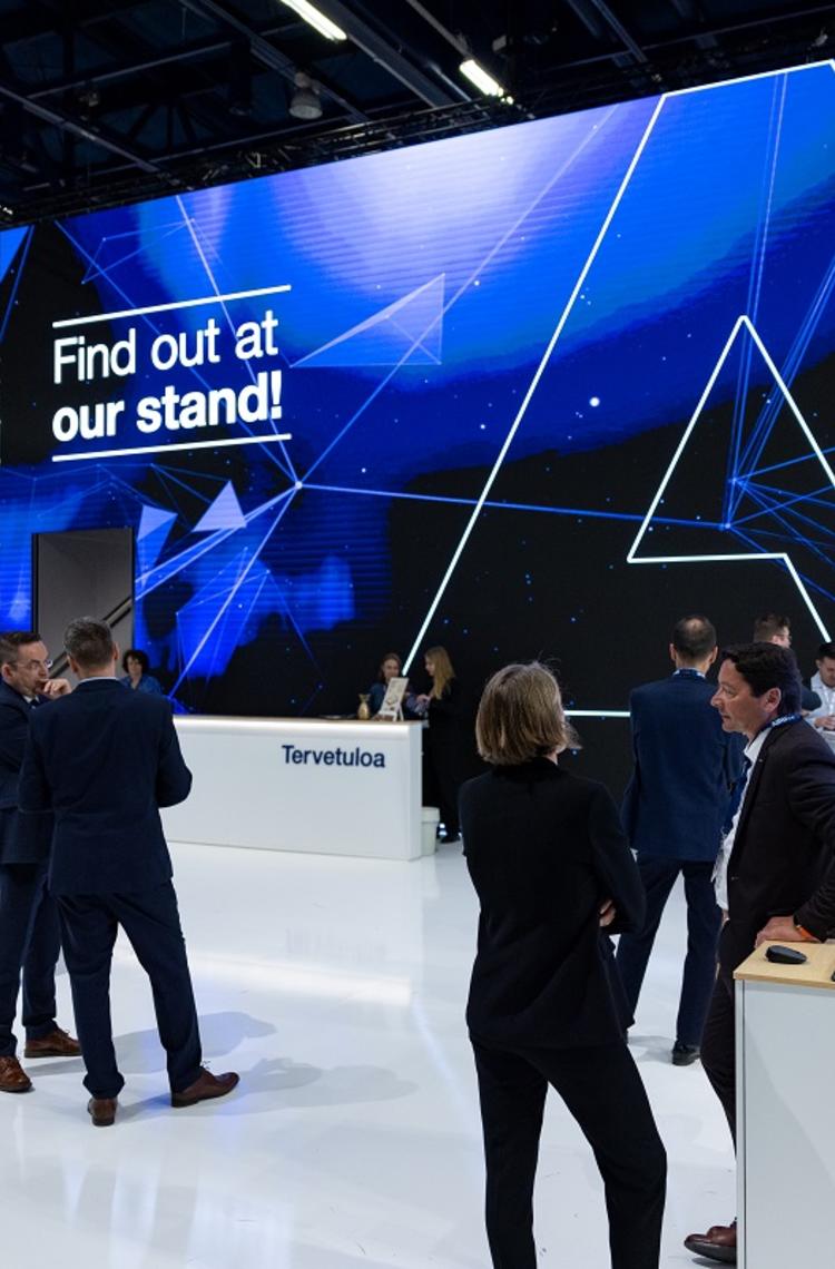 CCW 2023 - Airbus stand front view with people and big screen CCW 2023 - Airbus stand front view with people and big screen
