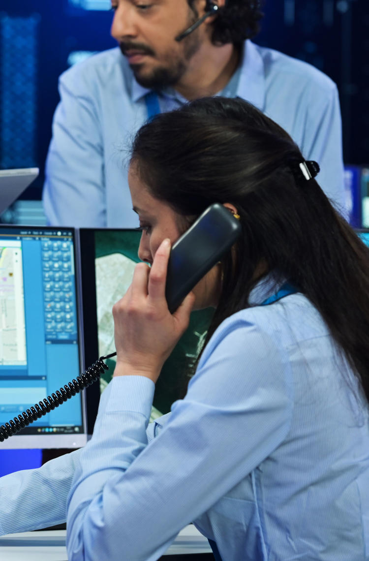 Command and control room officer talking to a TPH900 tetra terminal Command and control room officer talking to a TPH900 tetra terminal