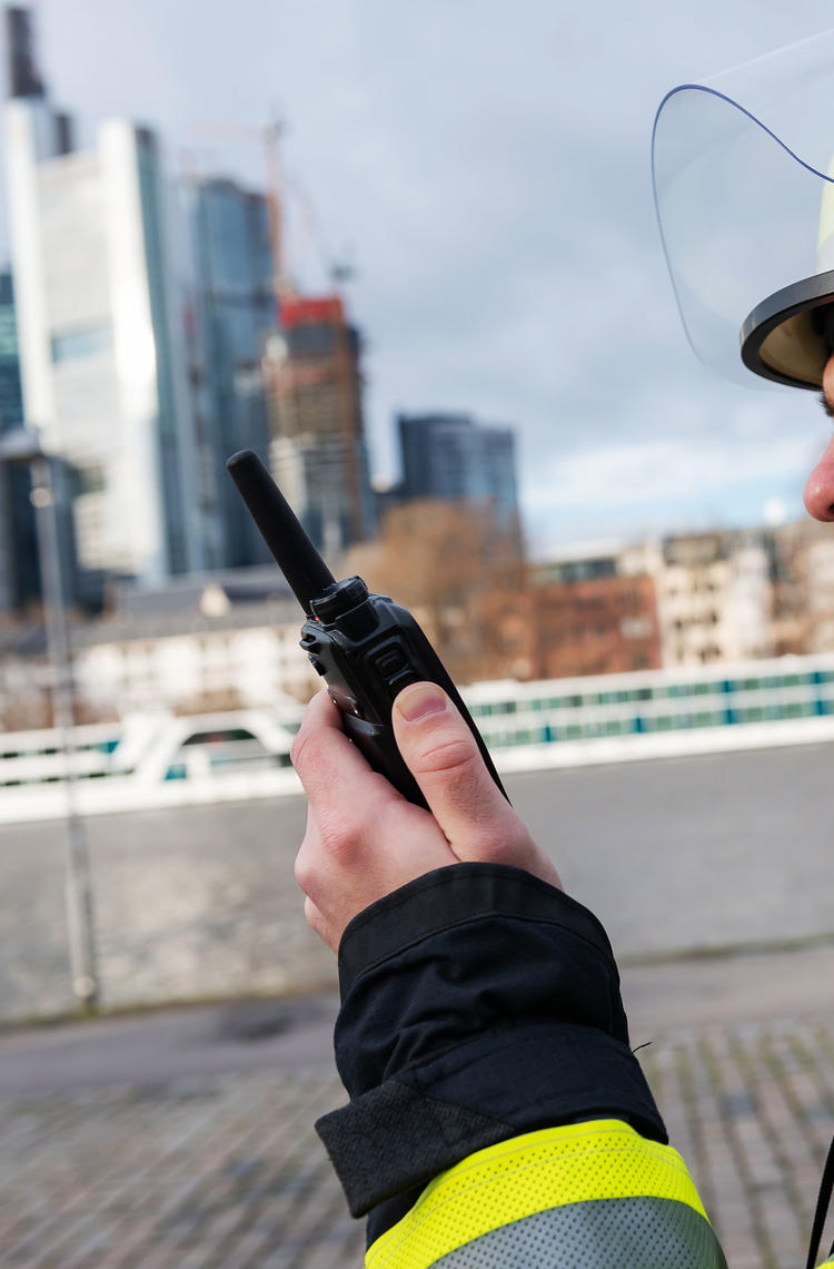Fireman talking to a TH9 TETRA Terminal