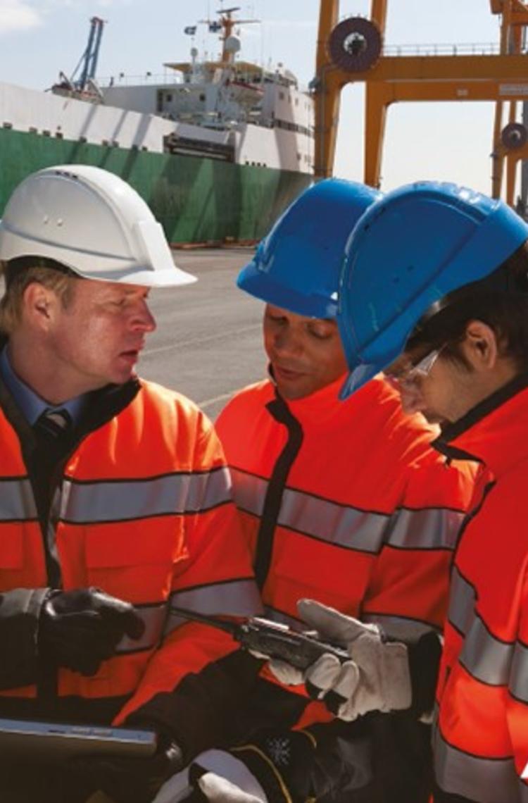 Industry workers using and device