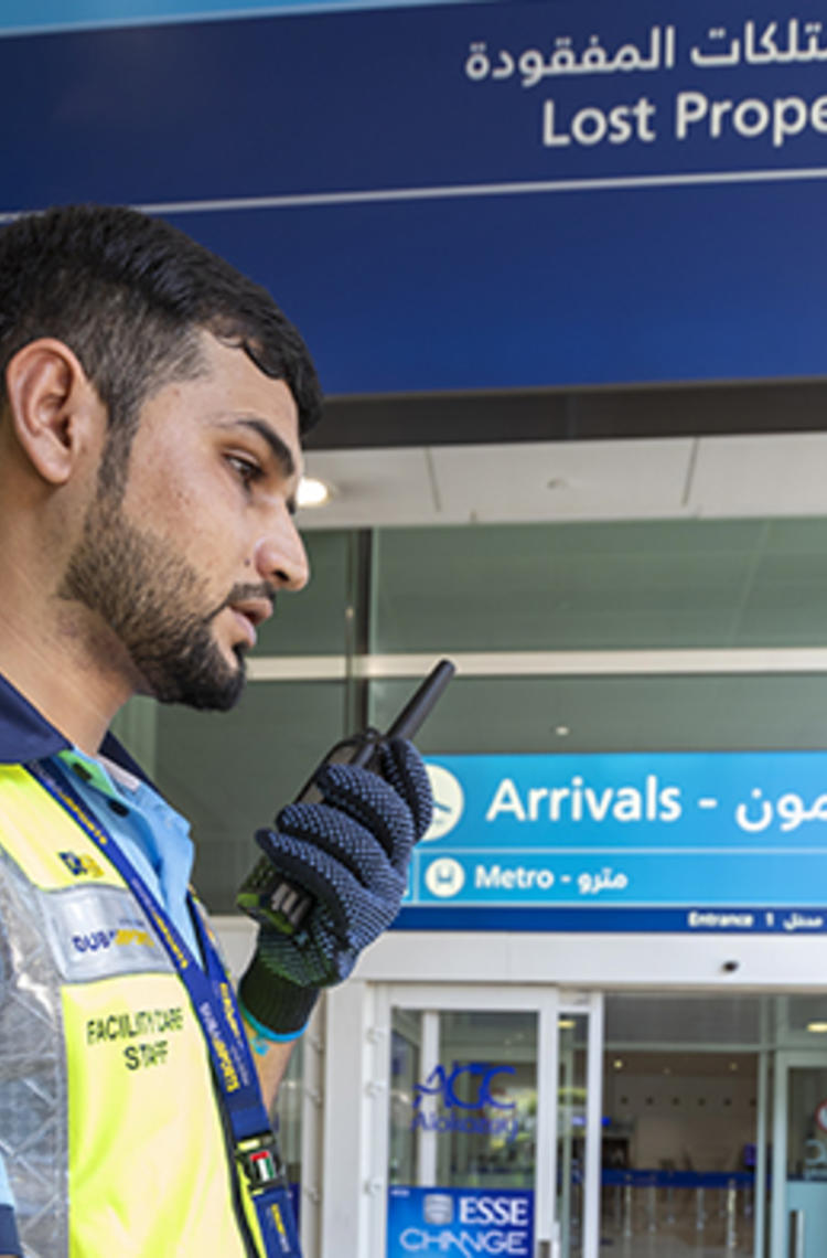 Dubai airport trolley staff with TETRA radio Dubai airport trolley staff with TETRA radio