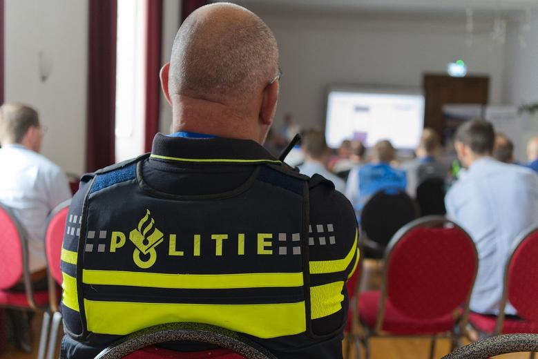 Belgium Police man sitting in a conference room for a Broadway project presentation