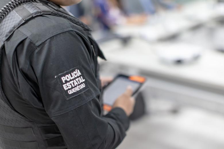 Close view on Querataro policeman holding a Tablet