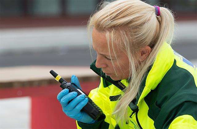 Paramedic talking to TH9 TETRA radio