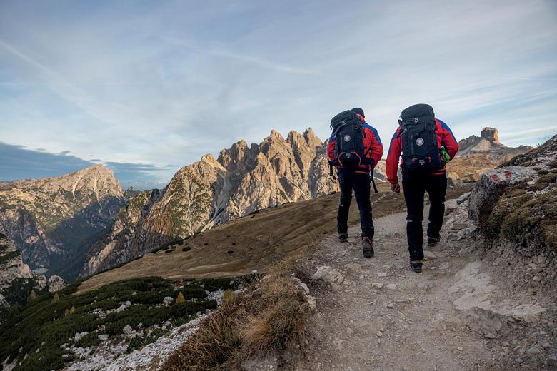 Two hikers walking in the moutains