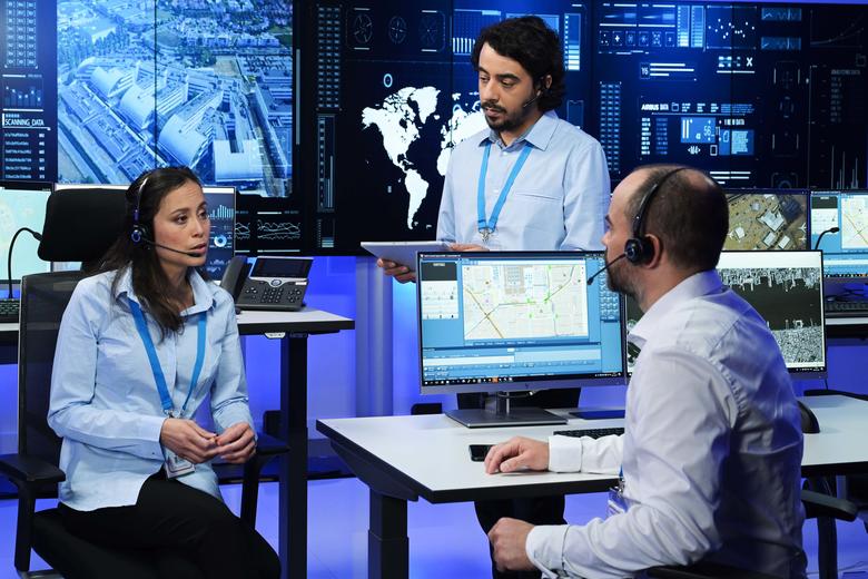 Command and Control room operators discussing the mission and using RCS9500