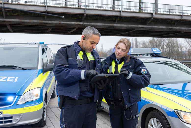 Police officers using a tablet 