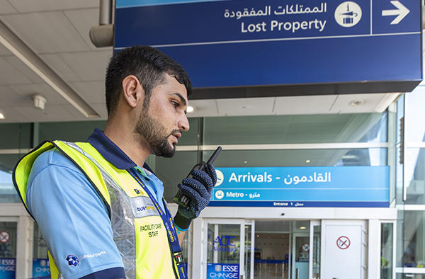 Dubai airport trolley staff with tetra radio Dubai airport trolley staff with tetra radio