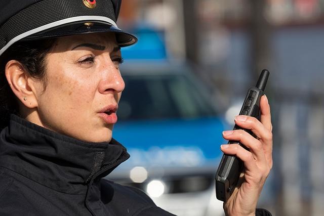 German policewoman talking to Tactilon Dabat
