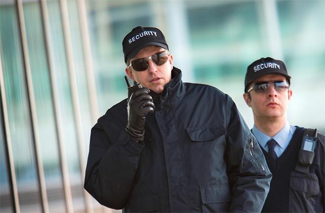 Two security officers with TH1n TETRA radio